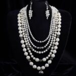 Five-strand necklace of round white corals — handmade jewelry by Frolov Jewels