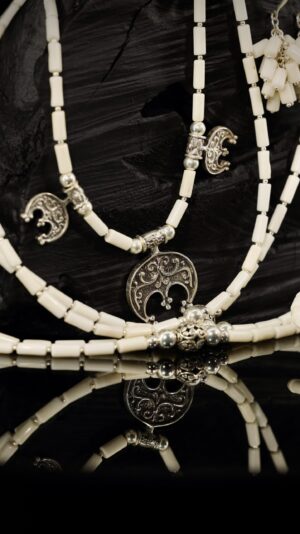 White coral necklace with silver lunnytsia crescents — handmade jewelry by Frolov Jewels